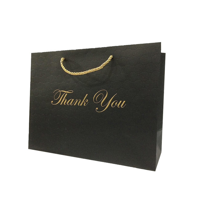 El bolso de empaquetado de la ropa de papel negro de lujo del logotipo personalizado le agradece la bolsa de papel del bolso de compras del regalo