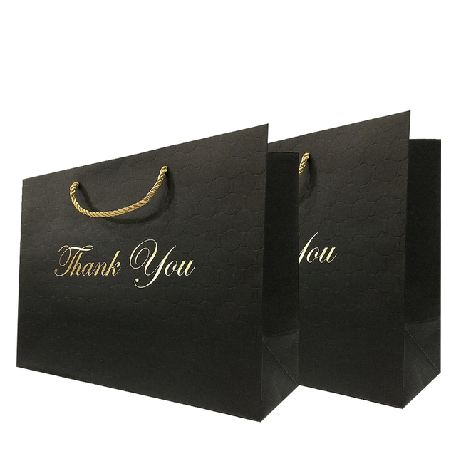 El bolso de empaquetado de la ropa de papel negro de lujo del logotipo personalizado le agradece la bolsa de papel del bolso de compras del regalo